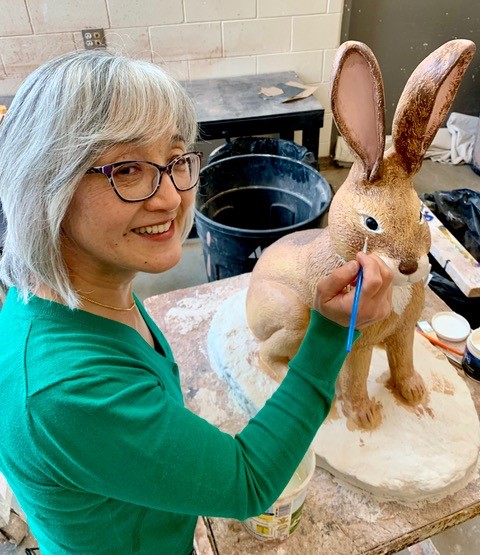 ACC Art Student painting a sculpture